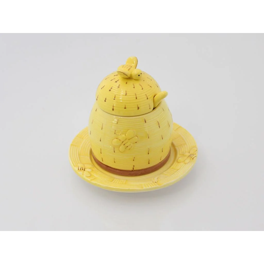 Gul honningkrukke med bier