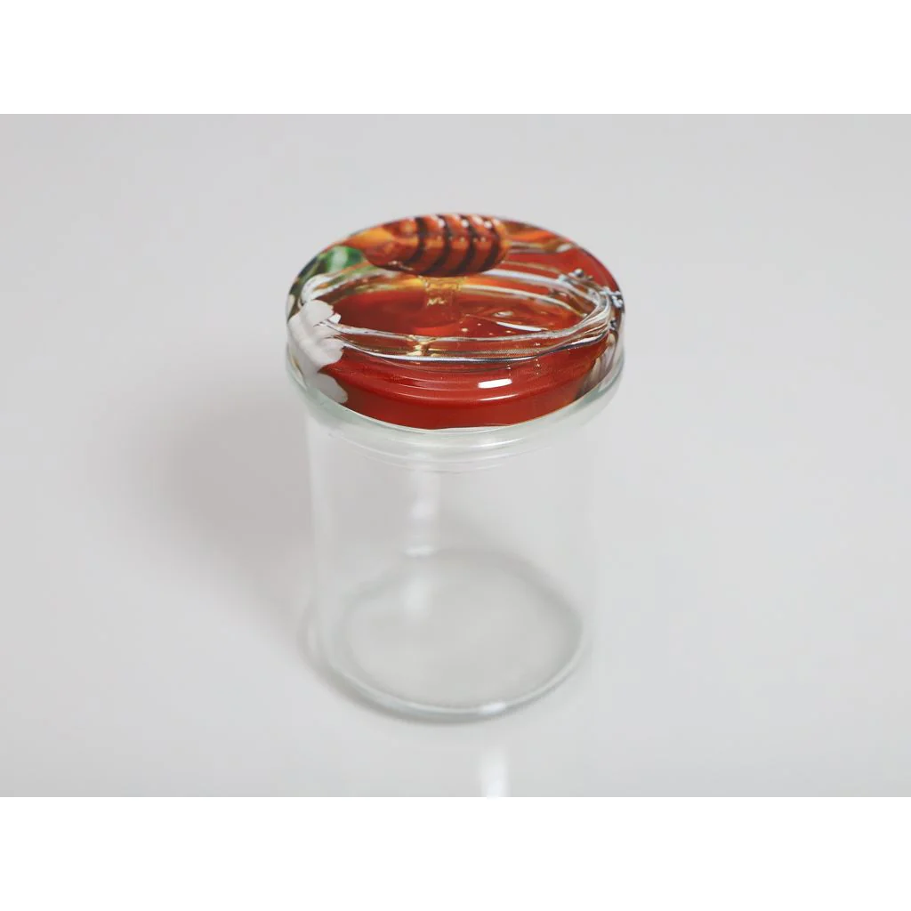 Honningtyv i nyslynget honning (foto)